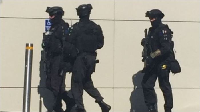 Armed police race through a Christchurch shopping mall